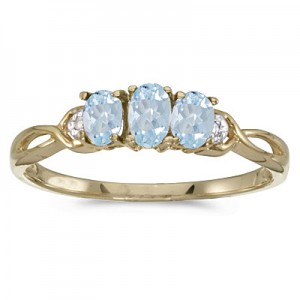 10k Yellow Gold Oval Aquamarine And Diamond Three Stone Ring