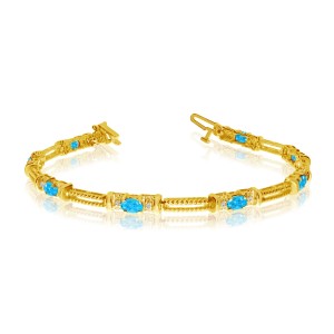 14K Yellow Gold Oval Blue Topaz and Diamond Bracelet
