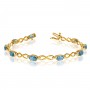 10K Yellow Gold Oval Blue Topaz and Diamond Bracelet